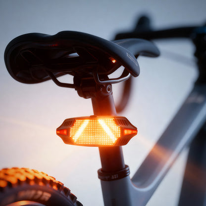 Guardian smart LED taillight mounted on seat post showing orange arrow turn signal active